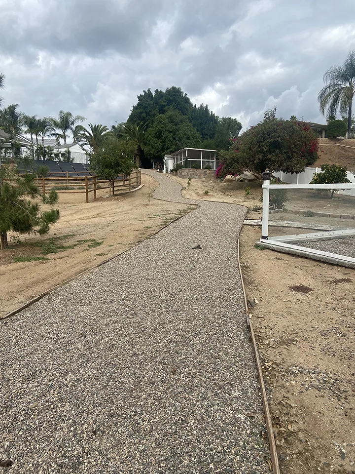 Bare backyard dirt slope before landscape remodel