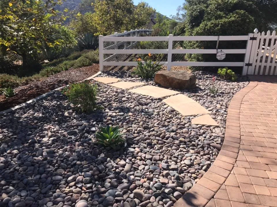 Phase 2 setting natural flagstone stepping stones along graded pathway in Alpine CA